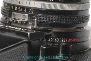 My first Nikon camera, a Nikkormat FTN I bought in the 70s, didn't have exposure modes, just a dial for shutter speed and a ring for aperture. Nikon D70, ISO 640, 1/60, f/14, 105mm Micro. Photo copyright Reed Hoffmann.