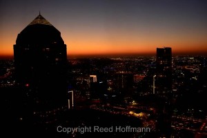 Dallas skyline from the 40th floor. Nikon D5200 set to white balance of SHADE and ISO of 200, shutter speed of 1.0 at f/5.6, with exposure compensation at  -3.7, 10-24mm f/3.5-4.5 lens. Photo copyright Reed Hoffmann.