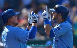 Alex Gordon (right) and Billy Butler celebrate a Gordon home run. Photo by Reed Hoffmann, Copyright The Associated Press.