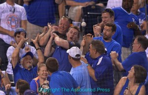 Fans try to catch a foul ball. Photo by Reed Hoffmann, Copyright The Associated Press.