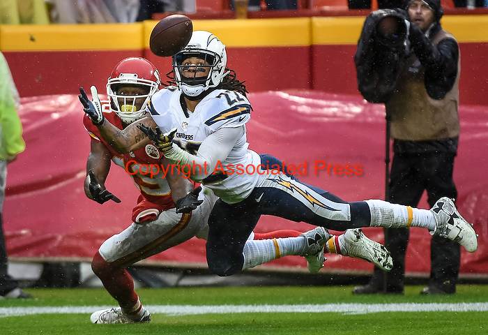 San Diego Chargers cornerback Jason Verrett (22) makes an interception of a pass intended for Kansas City Chiefs wide receiver Jeremy Maclin (19) during the first half of their NFL football game in Kansas City, Mo., Sunday, Dec. 13, 2015. (AP Photo/Reed Hoffmann) Nikon D4S, Aperture Priority, ISO 2200, 1/1600 at f/4.5, Nikkor 200-400mm f/4 lens.