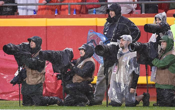 They probably weren't happy, but these photographers were well-prepared to cover Sunday's Chiefs/Chargers game. Nikon D4S, Aperture Priority, ISP 2500, 1/800 at f/4, Nikon 200-400mm f/4 lens. Photo by Reed Hoffmann