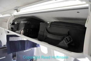 Make sure and check the size and weight restrictions for overhead bins before traveling, or you may have to gate check your camera gear. Photo copyright Reed Hoffmann.